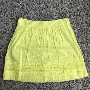 Above the knee yellow eyelet skirt